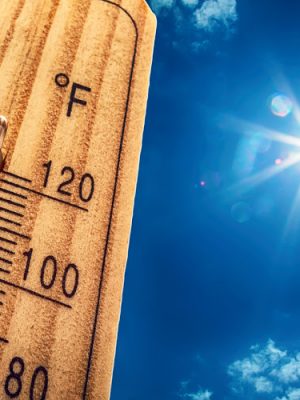 Thermometer Sun Sky 40 Degres. Hot summer day. High Summer temperatures in degrees Celsius and Farenheit.